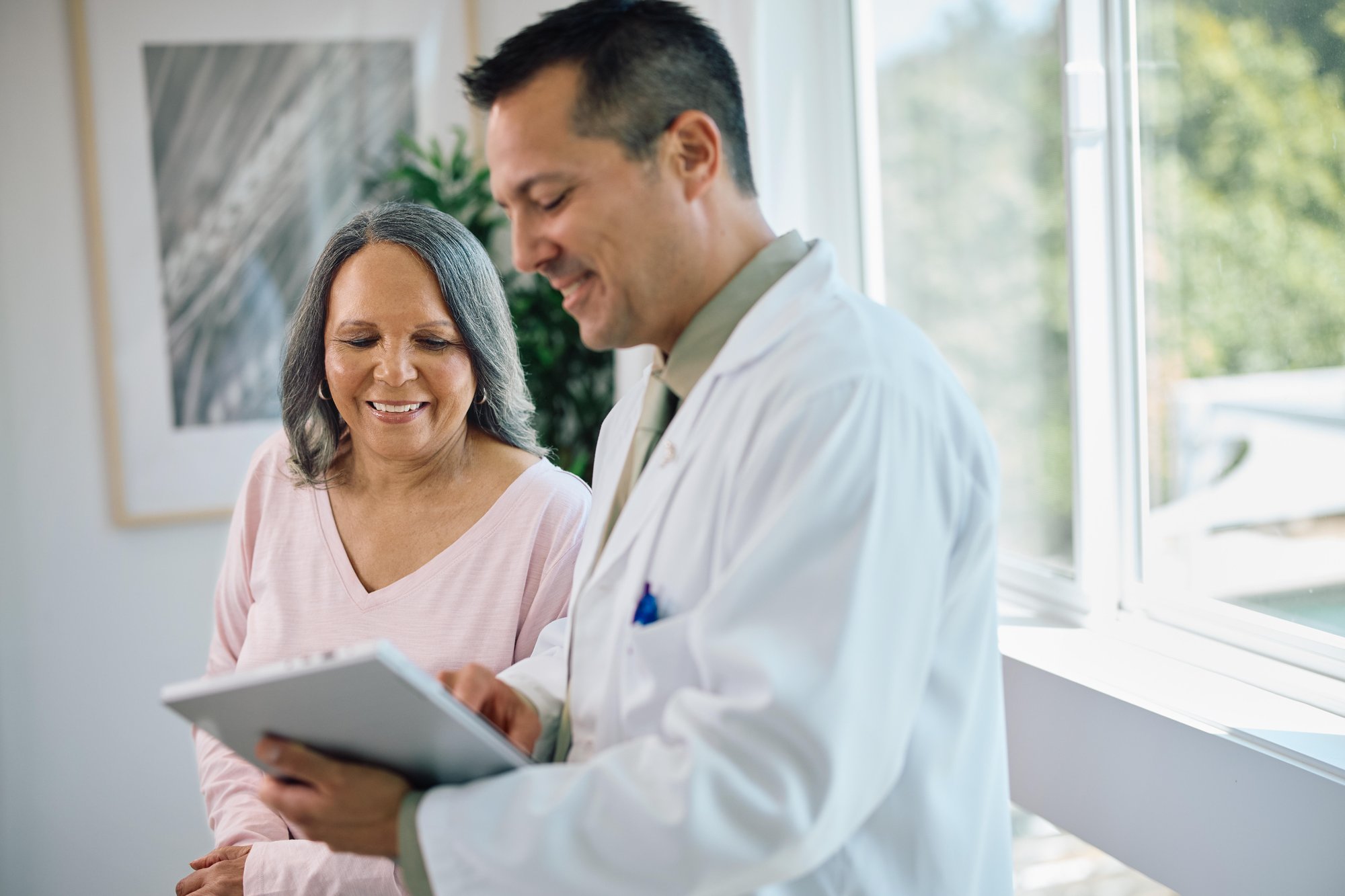 Male doctor with female patient
