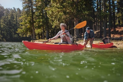 Couple kayaking energetically because of their good night sleep
