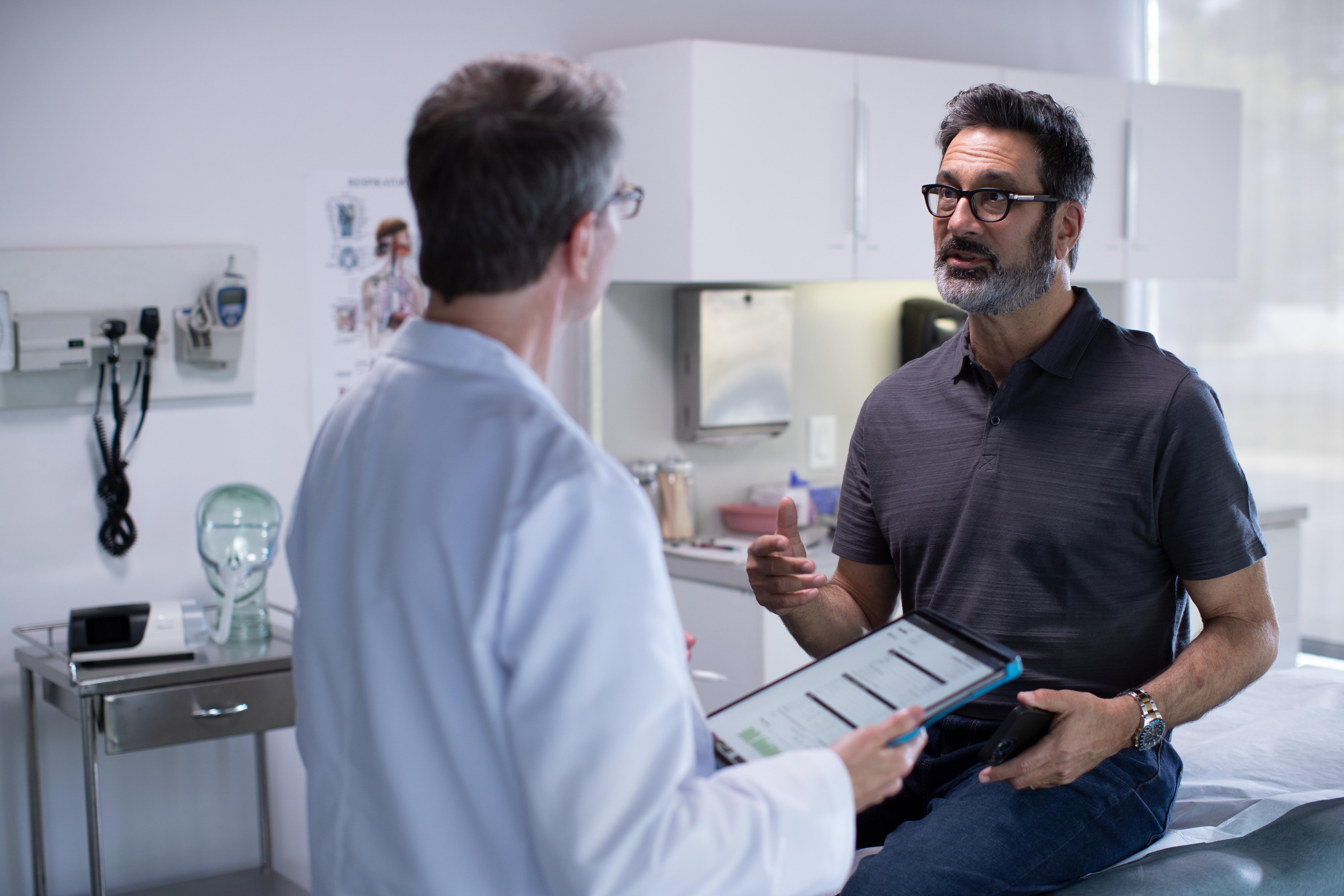 Man having conversation with his doctor in the clinic 