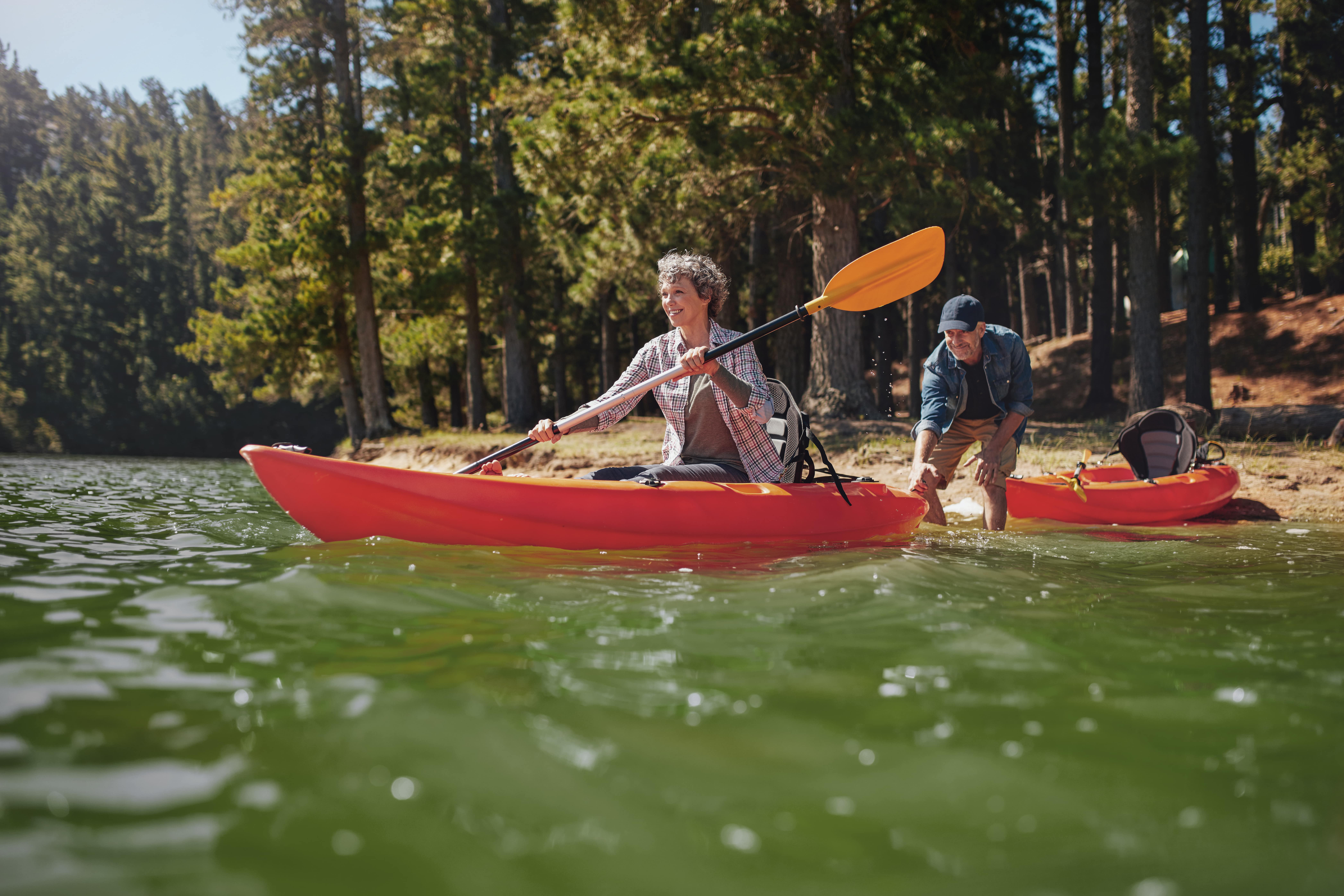 Couple kayaking energetically because of their good night sleep